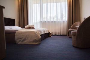 Postel nebo postele na pokoji v ubytování Amber Studio