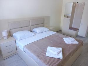 Postel nebo postele na pokoji v ubytování H.A.S.K
