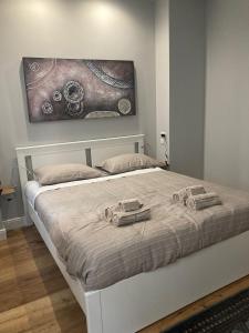 a bedroom with a bed with two toy cars on it at City Life Top apartment in Milan