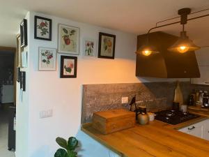 a kitchen with a wooden counter top in a room at Casa Maria in Scauri
