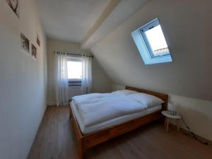 Postel nebo postele na pokoji v ubytování Ferienwohnung Mühlennest