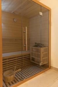 a room with a sauna with a glass wall at Laid Back Villa in Budapest +16 photos