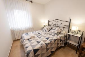 Postel nebo postele na pokoji v ubytování VuT El Pozo la Carrera 2