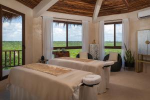 Una cama o camas en una habitación de Nerea Tulum