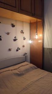 a bedroom with a bed and a wall with butterflies at Pousada Corumba Center in Corumbá