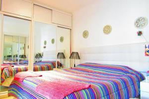 Ένα ή περισσότερα κρεβάτια σε δωμάτιο στο Solanas Gardens View Duplex con Parrillero para 7 personas +17 φωτογραφίες