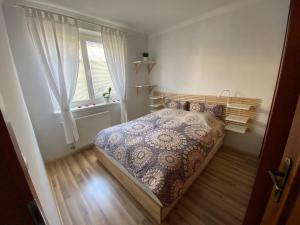 Postel nebo postele na pokoji v ubytování Apartmán Pošta
