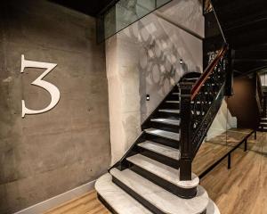 a staircase in a building with a number on the wall at Yotel San Francisco in San Francisco