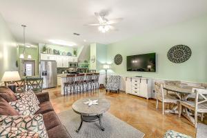 a living room with a couch and a table at Turtle Time in Port Aransas