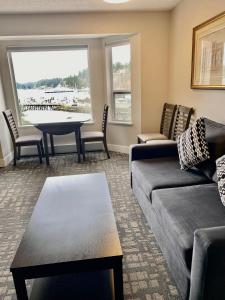 a living room with a couch and a table at High Point Resort in Quathiaski Cove