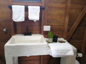 a bathroom with a sink and towels at El Regalo El Cuyo in El Cuyo +114 photos