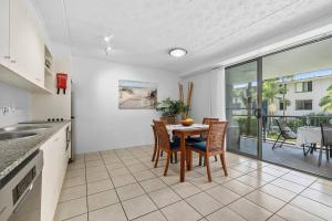a kitchen with a table and chairs in a room at Your place. Enjoy the beach retreat in Rainbow Beach