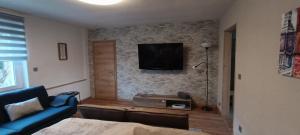 TV a/nebo společenská místnost v ubytování Haus MaRi
