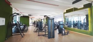 a gym with a bunch of treadmills and machines at Sunway Paradise Home Staycation PH2120 SELF CHECK IN OUT in Subang Jaya