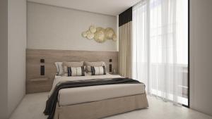 a bedroom with a large bed and a window at M. HOTEL in San Antonio