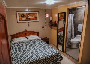 Ένα ή περισσότερα κρεβάτια σε δωμάτιο στο Di Giorgio Hostal