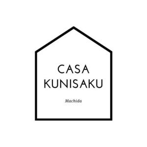 a black and white logo for csa kimiryksu at CASA KUNISAKU in Machida