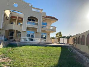 a large house with a yard in front of it at Hurghada 4 bed Villa in Hurghada