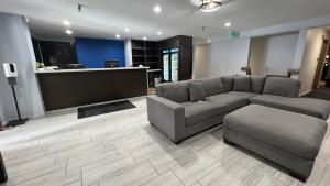 a living room with a couch and a table at SureStay Plus Hotel by Best Western Mammoth Lakes in Mammoth Lakes