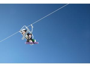 a person on a ski lift in the sky at Rifugio 2000 in Alpe Ciamporino