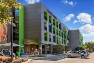 a rendering of a building with cars parked in a parking lot at Mercure Bendigo Schaller in Bendigo