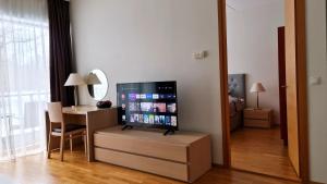 A television and/or entertainment centre at Seedri Residence