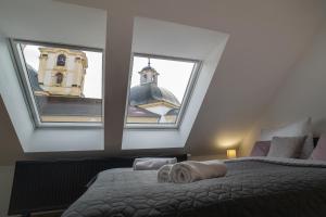 Postel nebo postele na pokoji v ubytování Hotel Smrž