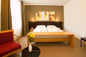 Posteľ alebo postele v izbe v ubytovaní Hotel Purkmistr