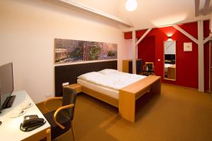Hotel Purkmistr tesisinde bir odada yatak veya yataklar
