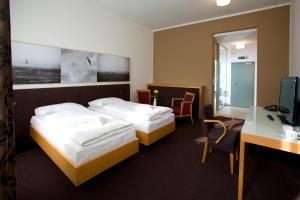 Posteľ alebo postele v izbe v ubytovaní Hotel Purkmistr