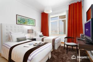 Postel nebo postele na pokoji v ubytování Dream Inn - Shoreline Palm Jumeirah