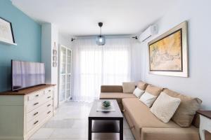 Televízia a/alebo spoločenská miestnosť v ubytovaní Apartamento La Pampa