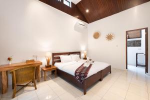 Una cama o camas en una habitación de Murex Dive Resort
