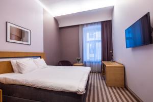 Hotel Soho的电视和/或娱乐中心