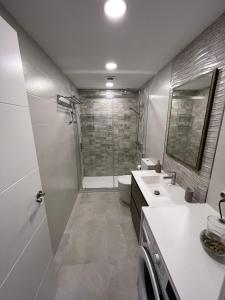 a bathroom with a shower and a toilet and a sink at Fuengirola Center in Fuengirola +22 photos