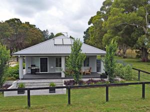 a house in the bush with a garden at The Bunkhouse in Exeter