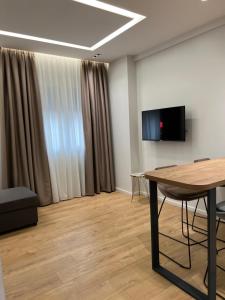 A television and/or entertainment centre at PIN Apartments