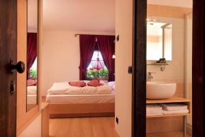 Postel nebo postele na pokoji v ubytování Hotel Fonte Dei Veli