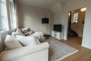 TV a/nebo společenská místnost v ubytování Appartement HIMMEL & Höllerl