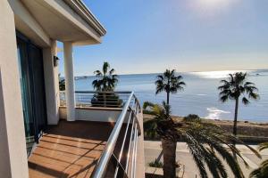 a balcony of a house with a view of the ocean at Miami Mar - Boutique Hotel & Restaurante in Sant Carles de la Ràpita