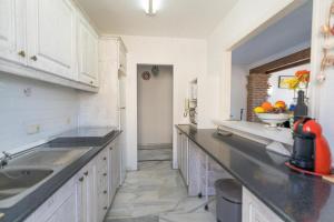 A kitchen or kitchenette at Real View Beach Front