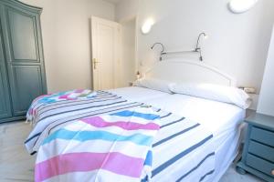 A bed or beds in a room at Real View Beach Front