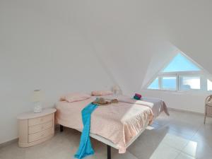 A bed or beds in a room at Duplex 506 Miraflores, fabulous terraces & views Még 31 kép