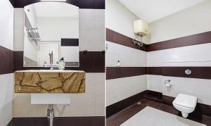 a bathroom with a sink and a toilet at Treebo Apollo in Guwahati