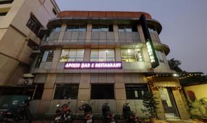 a building with motorcycles parked in front of it at Treebo Apollo in Guwahati