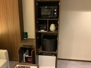 Kuchyň nebo kuchyňský kout v ubytování hotel brattostay ホテル ブラットステイ