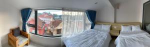 Postel nebo postele na pokoji v ubytování Thiên Thanh Hotel