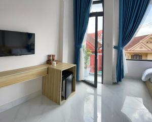 Postel nebo postele na pokoji v ubytování Thiên Thanh Hotel