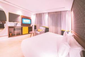 TV a/nebo společenská místnost v ubytování Oum Palace Hotel & Spa