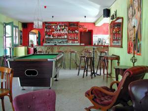 a bar with a pool table and some chairs at Camping Paduella in Calvi